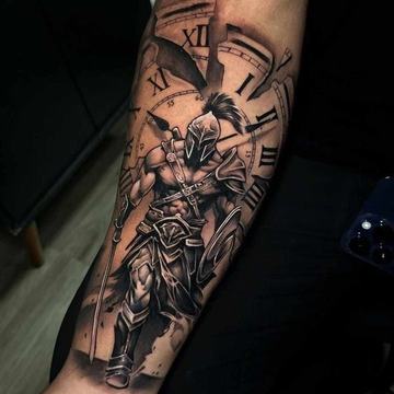 Spartan battle tattoo on forearm with clock background