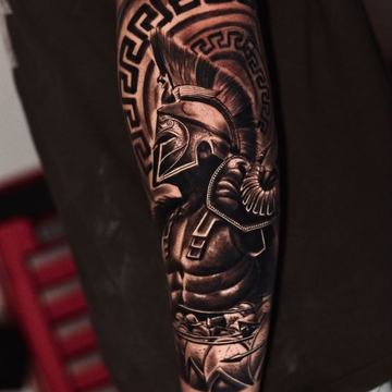 Spartan warrior tattoo on arm with Greek pattern