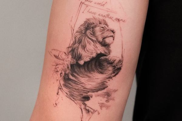 Sketch style lion tattoo with abstract brush effect