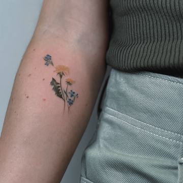 Small floral tattoo on the forearm